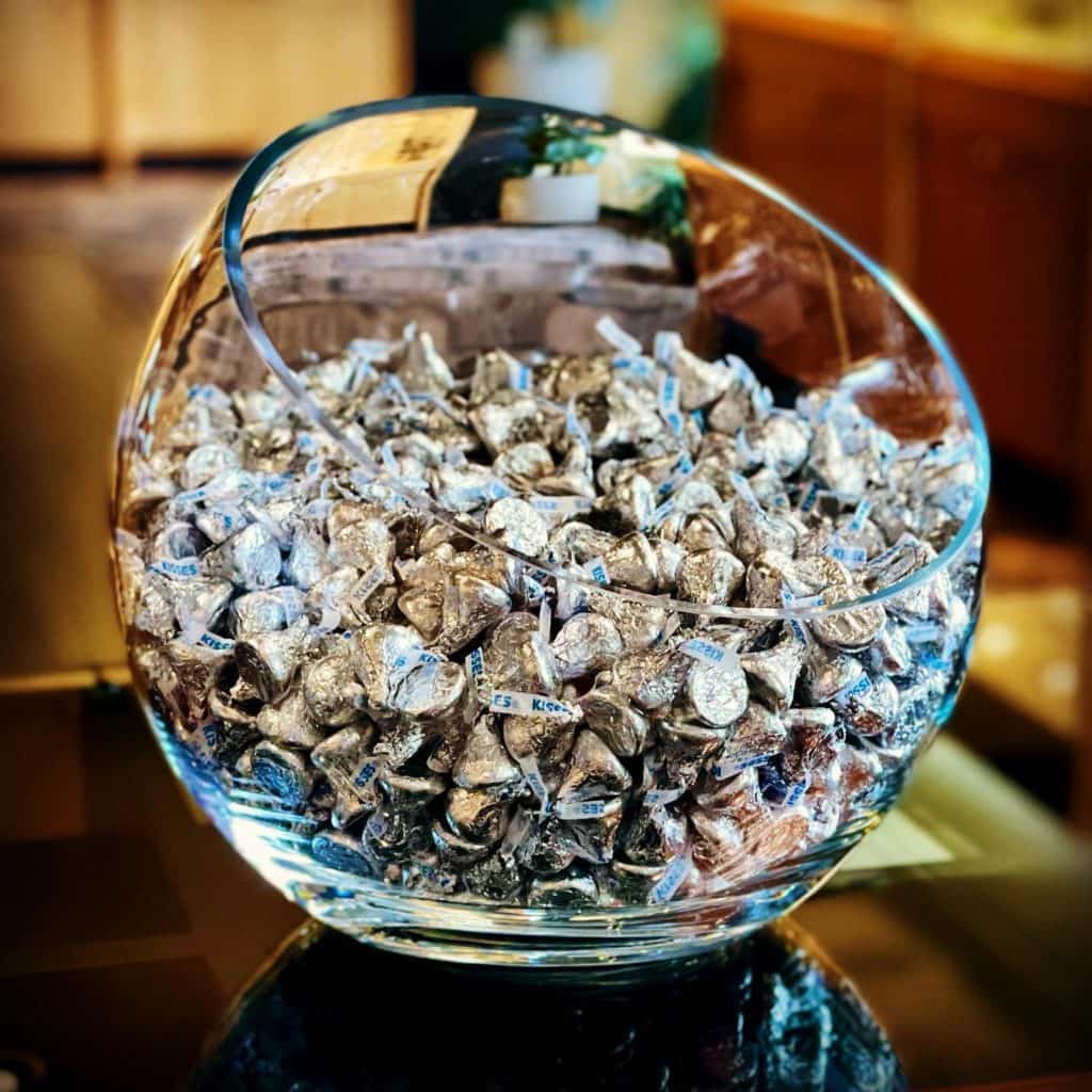 Glass bowl full of Hershey's kisses
