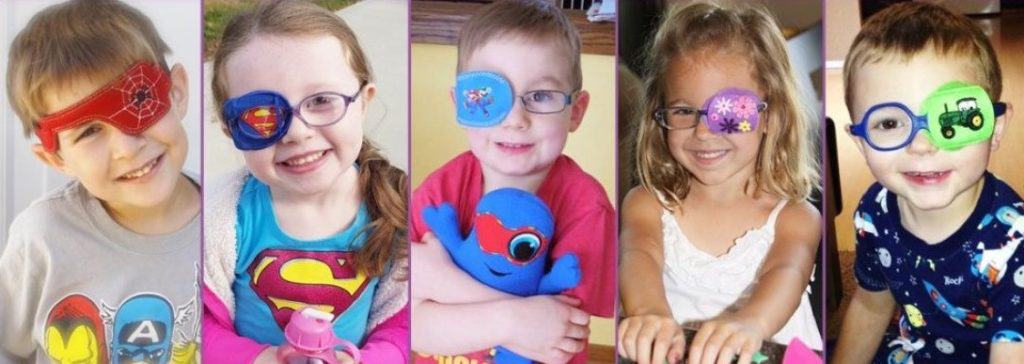 Five children wearing eye patches