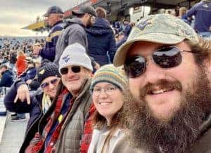 Family at WVU football game in the stands