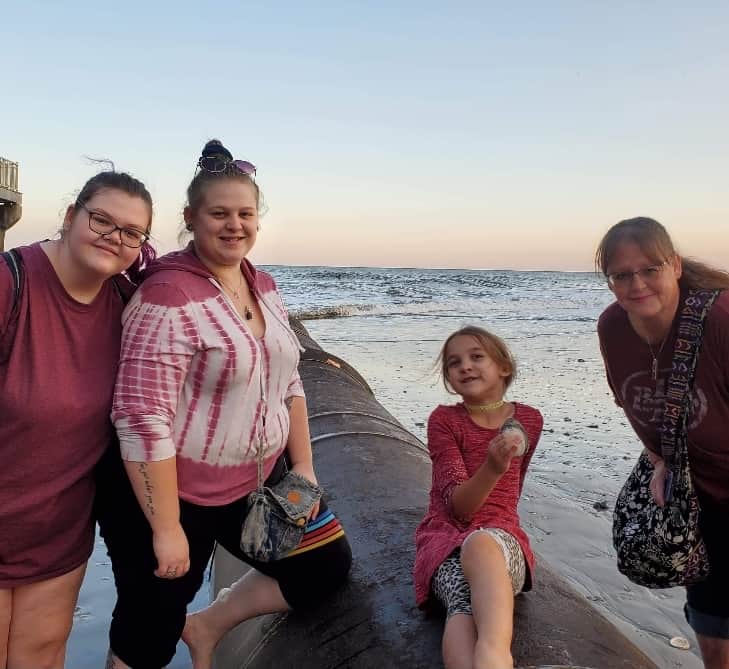 Three girls and their mom at the beach